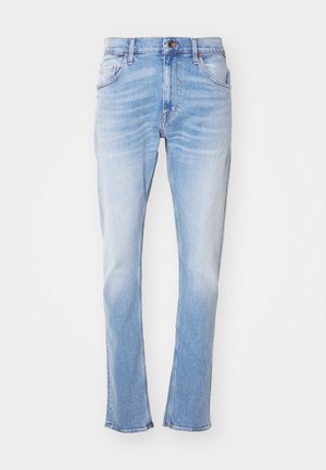 Light blue jeans made of denim, featuring a straight leg, subtle fading, five pockets, and button closure. No visible patterns or embellishments.