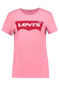 Růžové bavlněné tričko s velkým červeným logem Levi's na hrudi. Krátké rukávy a kulatý výstřih. Hladká textura.
