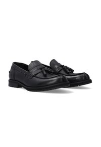 Schwarze Lederloafer mit glatter Oberfläche, dekorativem Quaste-Detail und einer niedrigen Gummisohle für guten Halt.