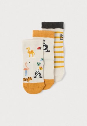 Tri par cotton mehice: ena z živalmi, druga z črtami in enobarvna. Vsak ima rumene, črne in smetanaste odtenke.