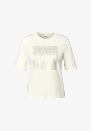 Camiseta blanca de algodón con mangas cortas y cuello redondo. Presenta un estampado gráfico plateado con texto centrado en la parte frontal.