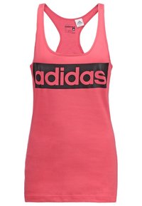 Pink tank top made of cotton, featuring a black adidas logo across the chest. Thin straps and a rounded neckline. Smooth texture.