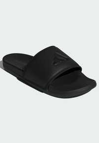 Black slide sandal made of rubber with a textured strap, featuring a raised logo and a contoured footbed for comfort.