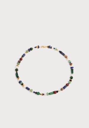 Multicolored beaded necklace with green, blue, red, and gold beads arranged in a circular pattern on a light background.