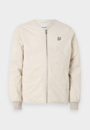 Bomber jacket beige chiaro con scollatura rotonda, zip frontale e due tasche laterali. Presenta un piccolo logo ricamato sul petto.