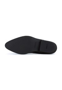 Suola nera di scarpa in gomma testurizzata per una migliore aderenza, caratterizzata da una finitura liscia, punta arrotondata e un logo discreto nella zona del tallone.