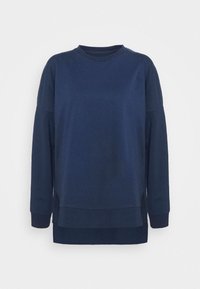Felpa blu navy a maniche lunghe realizzata in morbido cotone. Presenta un collo a giro, spacchi laterali e una vestibilità comoda con polsini e orlo a costine.