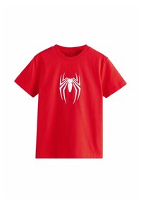 Rød bomulds T-shirt med et stort hvidt edderkoppelogo på forsiden. Korte ærmer og rund halsudskæring. Blød, glat tekstur.