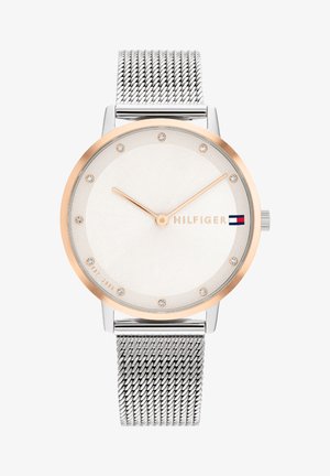 Silver mesh strap watch with a white dial, rose gold-tone bezel, and eight sparkling markers. Features brand name in silver.