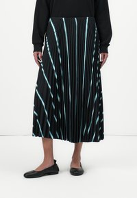 Black pleated skirt with vertical light blue stripes. Made of lightweight material, it falls mid-calf and features a smooth waistband.