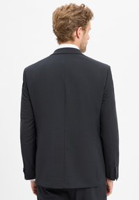 Giacca da abito grigio scuro realizzata in un tessuto liscio, con un design classico, apertura centrale sul retro e polsini con bottone.