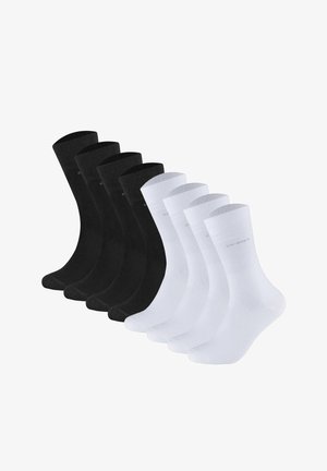 Vier schwarze und vier weiße knielange Socken, nebeneinander in zwei Reihen auf weißem Hintergrund angeordnet.