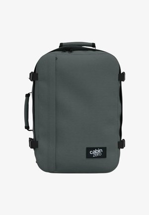 Valise souple rectangulaire gris foncé avec poignées latérales et supérieures, sangles de compression et écusson logo « cabin zero » à l'avant.