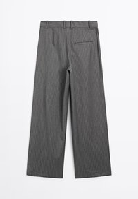 Gray wide-leg trousers with vertical pinstripe pattern, featuring a zip fly closure and a single back pocket. Smooth fabric texture.