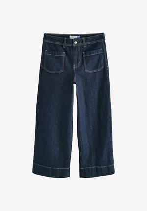 Plati kojos džinsai iš tamsaus džinsinio audinio, su mygtukų užsegimu, penkiomis kišenėmis ir kontrastinga siūle. Pagamintas su apverstais hem ir laisvu kirpimu.