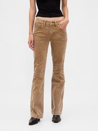 Brown corduroy flared jeans with two front pockets, a button and zip fly, and slight sheen. Paired with black top and boots.