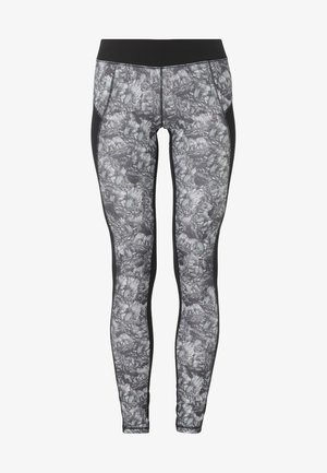 Soutien-gorge de sport noir associé à un legging taille haute gris et noir à motif, présentant un design élégant et des panneaux latéraux noirs.