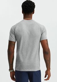 Gray short-sleeve t-shirt with a smooth texture and a round neckline. Features raglan sleeves and a close fit at the waist and shoulders.