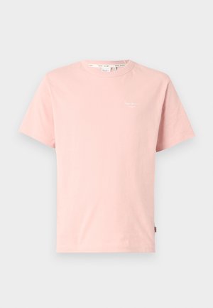 T-shirt en coton rose avec un col ras du cou, des manches courtes et un petit logo blanc sur la zone gauche de la poitrine. Texture douce et design simple.