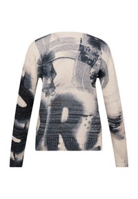 Gestrickter Pullover in Beige mit schwarzen abstrakten Mustern. Lange Ärmel, Rundhalsausschnitt und gerippte Saumdetails. Weiche Textur mit entspannter Passform.