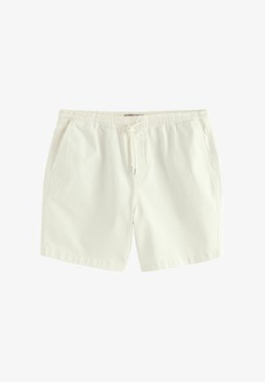 Białe bawełniane szorty z elastycznym pasem, zapięciem na sznurki i dwoma bocznymi kieszeniami. Gładka tekstura i luźny krój.