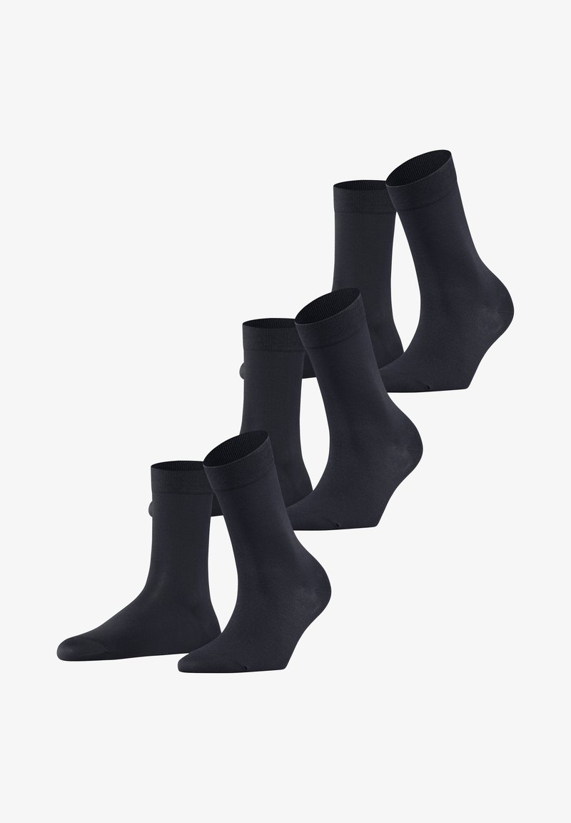 Svarta strumpor i fempack; medellång längd, slät textur, enfärgad och med elastiska muddar. Enkel design utan mönster eller dekorationer.