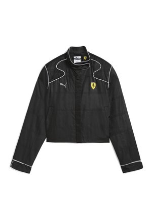 Must mustukas lühike jakk sujuvast kangast. Omab valget kontrastõmblust, kõrget kraed ja logo Puma ja Ferrari rinnal.