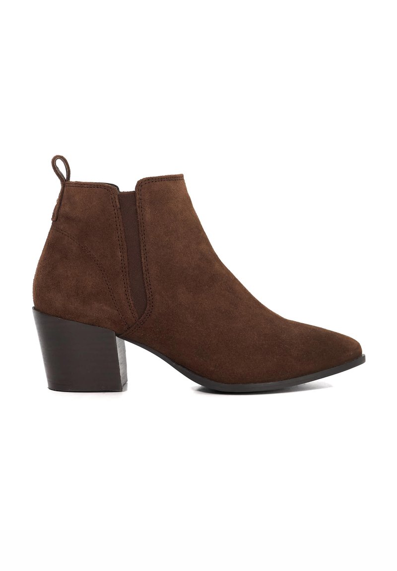 Brown suede ankle boot with a pointed toe and a short stacked heel. Features elastic side panels and a pull tab at the back for easy wear.