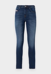 Jeans de tiro medio en denim oscuro, ajustados y con un diseño de cinco bolsillos, presentando un ligero desgaste en los muslos. Cierre clásico con botón de metal.