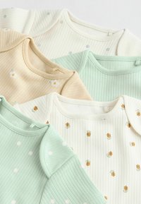 Set aus fünf gerippten Baumwolloberteilen in Pastellfarben: Mint, Creme, Beige, mit Blumen- und Punktemustern. Weicher Stoff mit rundem Ausschnitt.