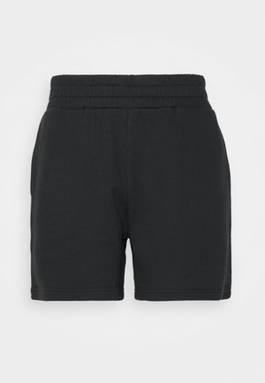 Svarta avslappnade shorts med elastisk midja och sidofickor på en enfärgad vit bakgrund.
