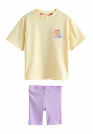 Yellow short-sleeve t-shirt with small colorful floral design on chest, paired with ribbed light purple knee-length shorts.