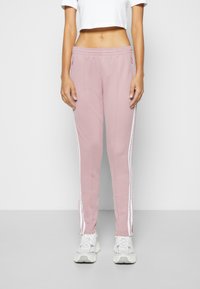 adidas Originals SUPERSTAR - Donji dijelovi trenirke - magic mauve