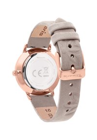 Roségoldene Uhr mit Edelstahlgehäuse, hellgrauem Wildlederarmband mit Blattmuster und sicherem Metallverschluss.