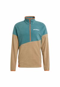 Fleece pullover in teal and tan, featuring a half-zip, orange accents, and a logo on the chest. Soft texture, relaxed fit.