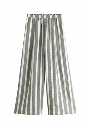 Raidalliset leveälahkeiset housut harmaassa ja valkoisessa. Pehmeä, teksturoitu kangas, jossa on joustava vyötärönauha ja väljät mitat, pystysuorat raidat.