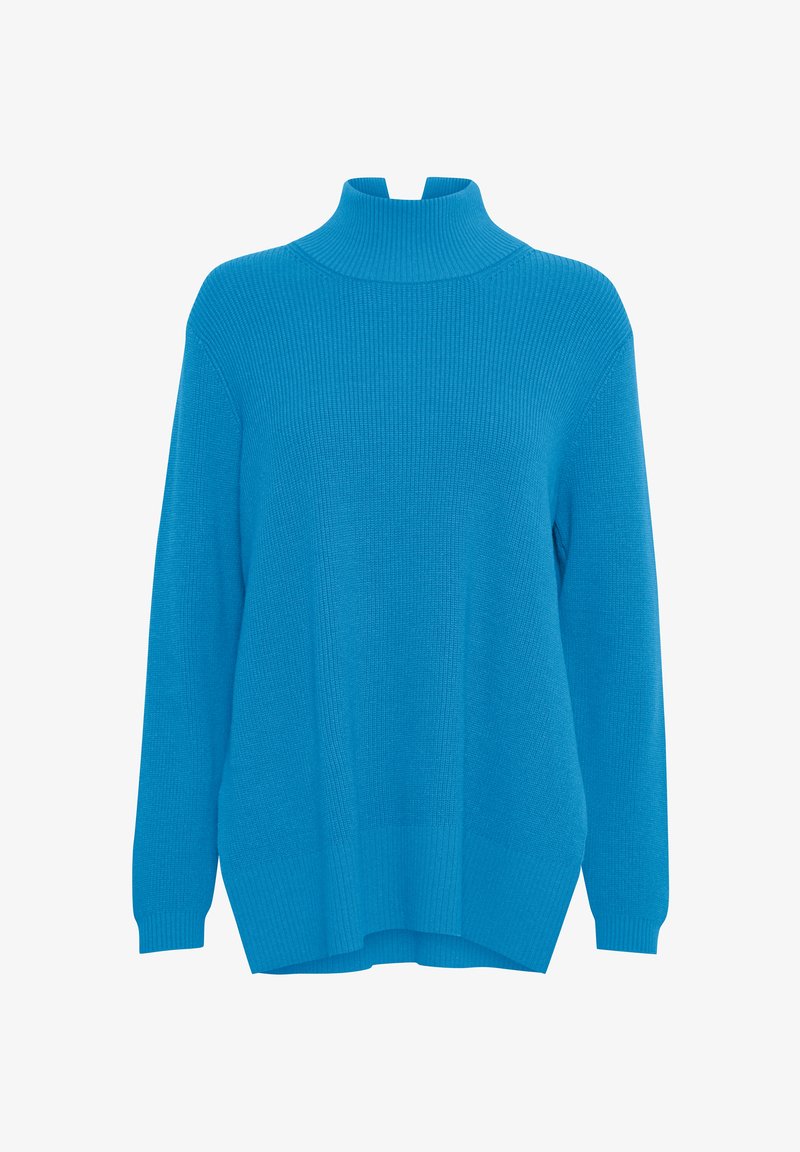 Turquoise coltrui met ribbelstructuur, lange mouwen en zijsplitten. De stof lijkt zacht en rekbaar, wat zorgt voor een losse pasvorm.