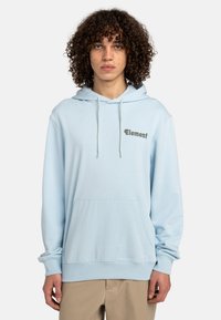 Light blue hooded sweatshirt made of soft fabric, featuring a front pocket and a small logo in dark green on the chest.