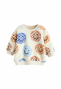 Cremfarbener, flauschiger Sweatshirt für Kleinkinder mit blau- und braun karierten Smileygesichtern, gerippten Bündchen und Kragen auf weißem Hintergrund.