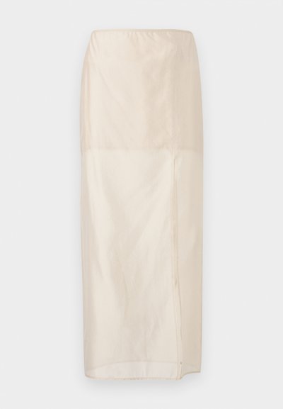 Fustă lungă bej transparentă, cu talie elastică și o fărâmă laterală, afișată întinsă pe un fundal alb.