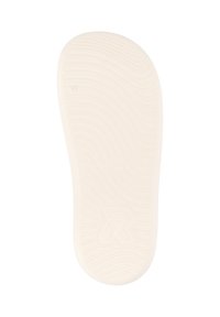 Sole of a shoe, made of white rubber, featuring a textured pattern with curved lines and a logo in the bottom right corner.