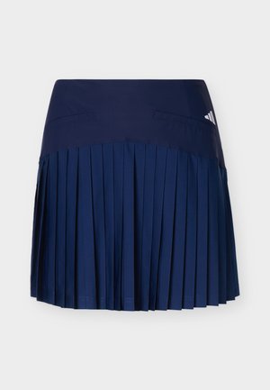 Jupe de sport plissée bleu marine avec une large ceinture et un petit logo Adidas en haut à droite.