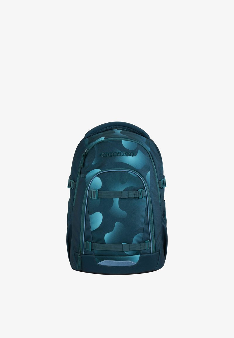 Sac à dos bleu sarcelle foncé avec un motif. Fabriqué en tissu durable, il comprend des bretelles réglables, des poches latérales et une poignée supérieure.