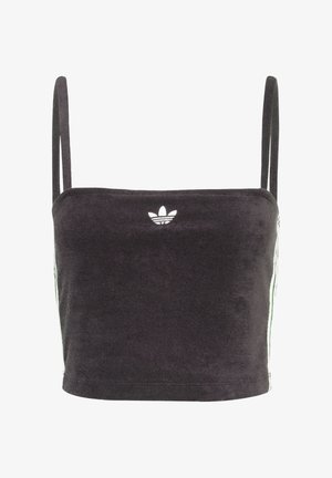 Crni kratki top od mekog materijala. Ima tanke naramenice i bijeli Adidas logo sprijeda, uz zelene pruge sa strane.