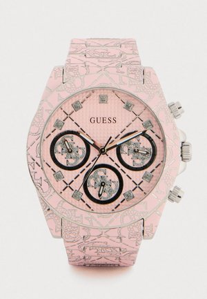 Relógio de pulso em silicone rosa com mostrador texturizado, três submostradores, detalhes em prata e marcadores semelhantes a diamantes, apresentando uma pulseira padronizada.