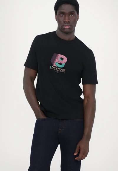 Black cotton t-shirt featuring a colorful geometric logo with the text "ATHLÉTIQUE" and city names. Plain design, short sleeves.