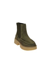 Bottines en suède vert olive avec des panneaux latéraux en élastique, bout rond et surface texturée sur une semelle chunky beige.