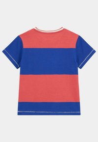 Short-sleeve t-shirt in red and blue horizontal stripes. Soft cotton material; features a crew neck and contrasting stitching details.