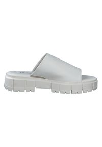 Sandalias blancas sin hebilla con un acabado mate y suave. Cuentan con una correa ancha y una suela gruesa y texturizada para un mejor agarre y estabilidad.