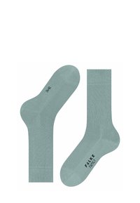 Helle grüne Baumwollsocken mit glatter Textur, die verstärkte Zehen und einen gerippten Bund haben. Der Markenname "FALKE FAMILY" ist sichtbar.